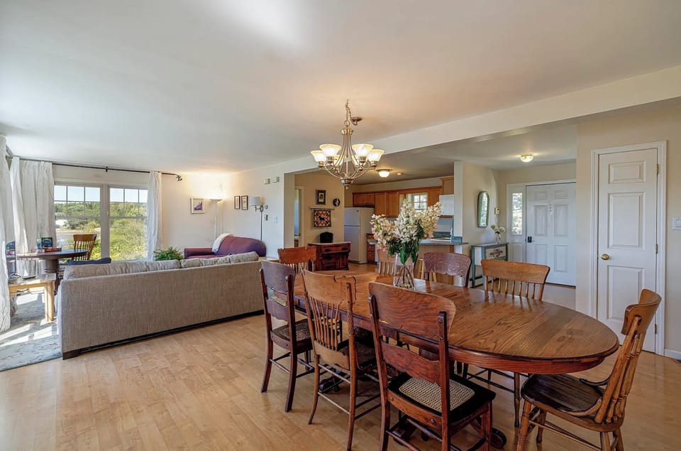 Prior photo of how the living room and dining room and kitchen was before 