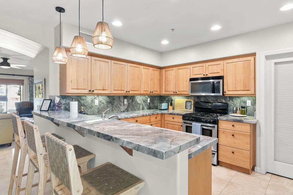 A fully equipped kitchen designed with both style and functionality in mind, offering everything you need to prepare meals with ease. Bright, spacious, and thoughtfully laid out for a seamless cooking experience.