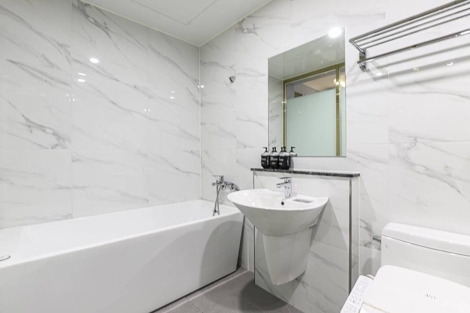 Separate tub and shower, slippers, towels
