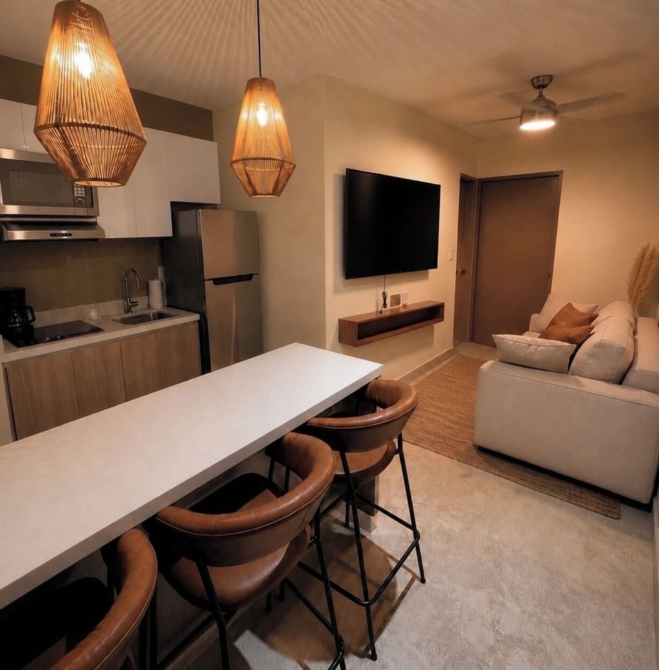 Open layout with kitchen, dining, and cozy living space.