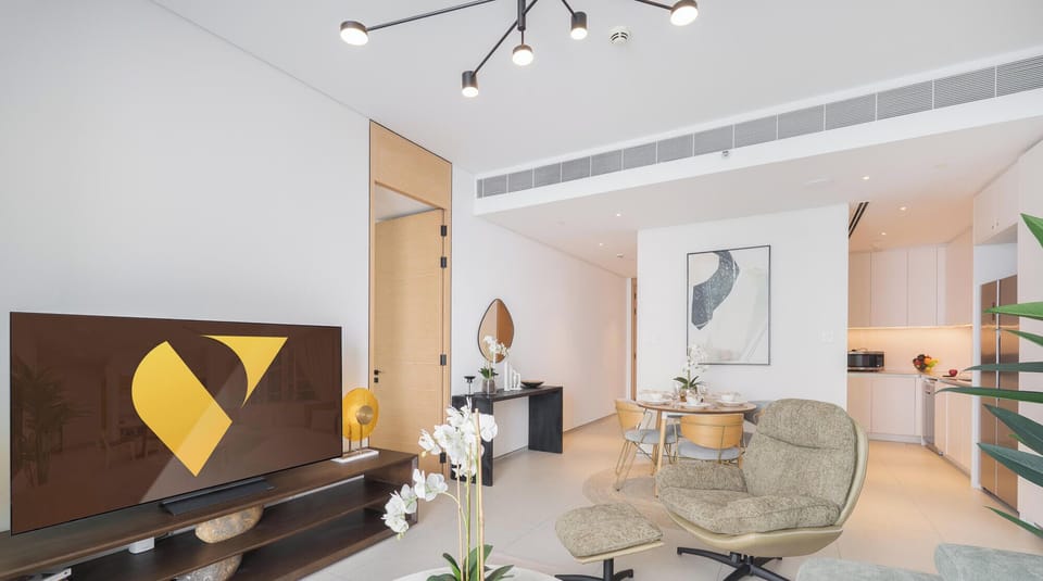 Luxury Apartment, Balcony, City View | Living area | 65-inch Smart TV with cable channels