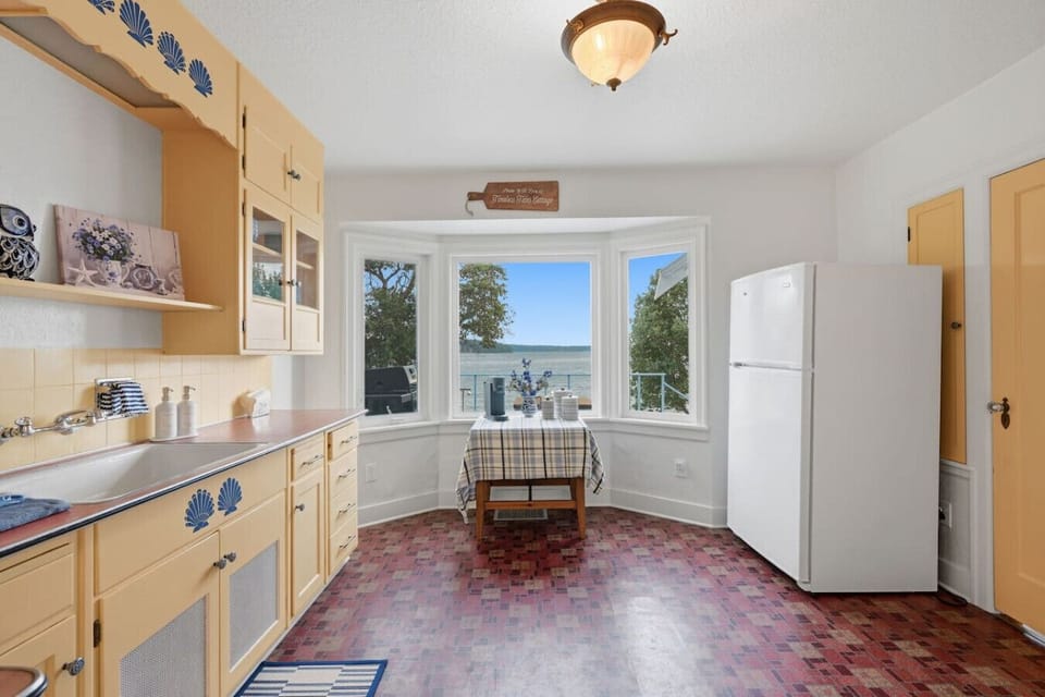 Cottage-style kitchen with everything you need for preparing meals during your stay.