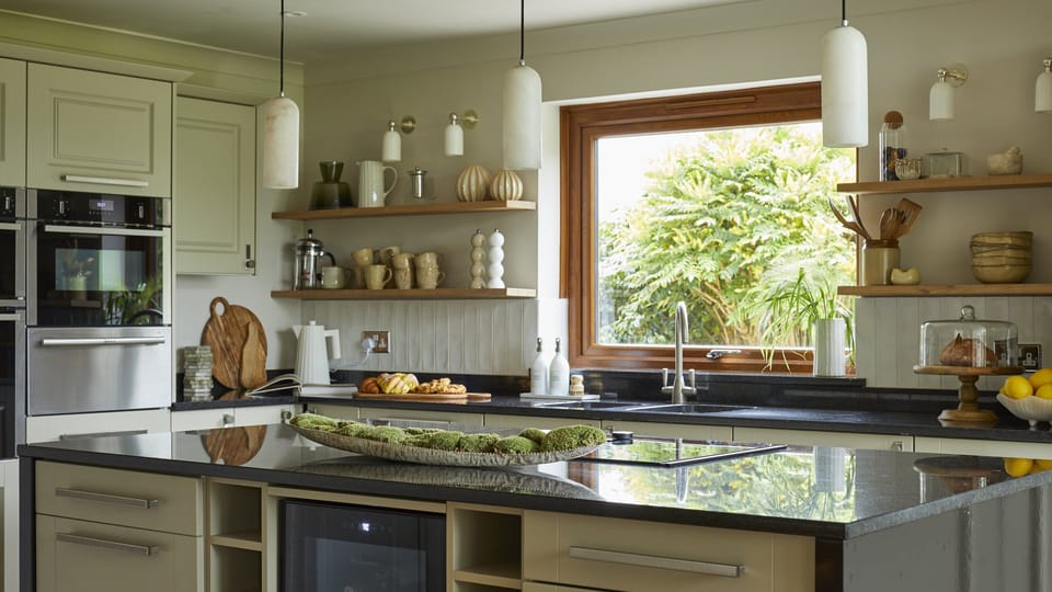 Kitchen with window views and open shelving