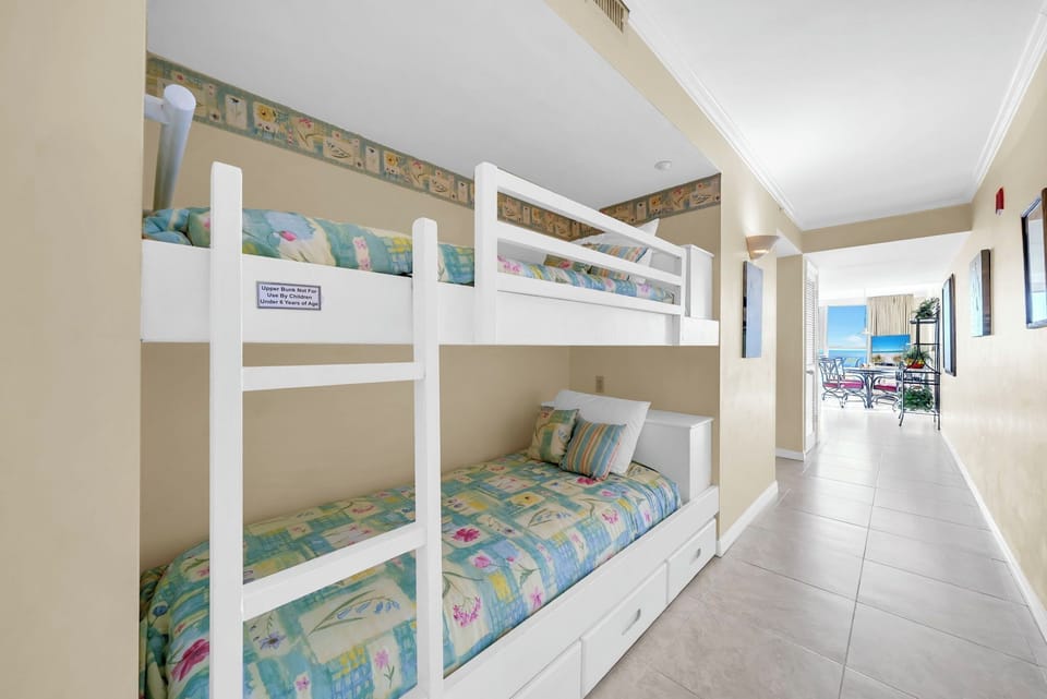 Your kids will love these cozy built-in twin bunks with cheerful bedding and ocean views just steps away.