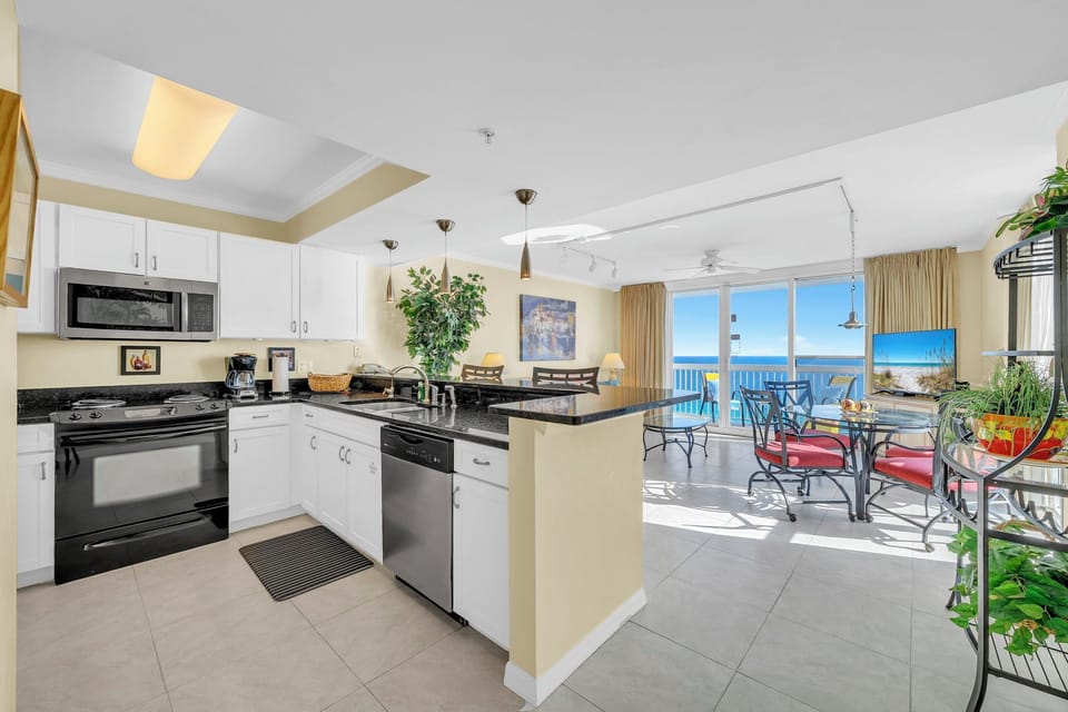 Step into your fully equipped kitchen with stunning ocean views where you'll love preparing meals with the sea as your backdrop.