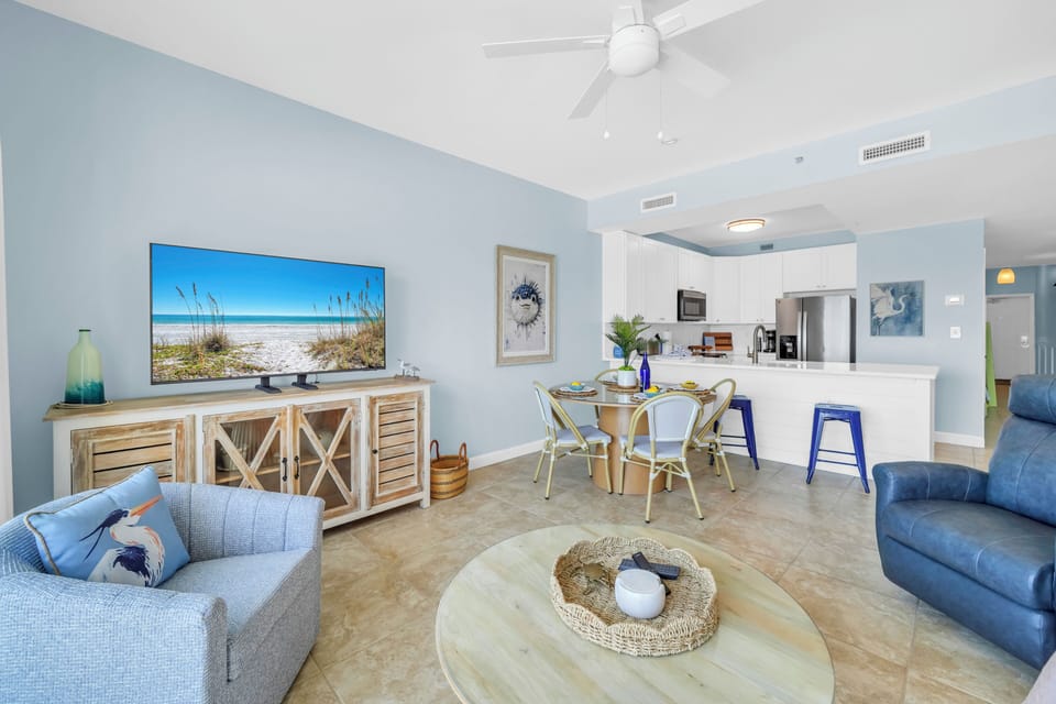 Relax in this bright coastal living space where soft blues and whites create a peaceful retreat with modern comfort.
