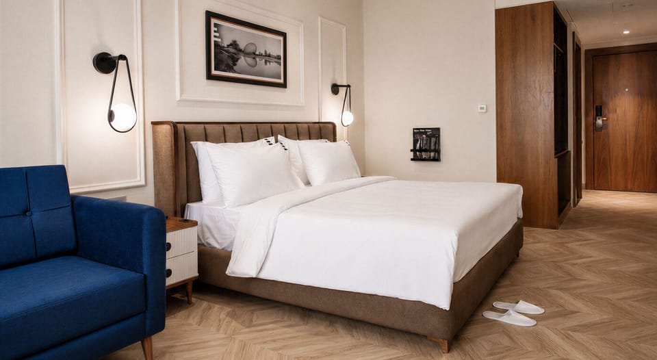 Deluxe Double Room | Desk, iron/ironing board, bed sheets