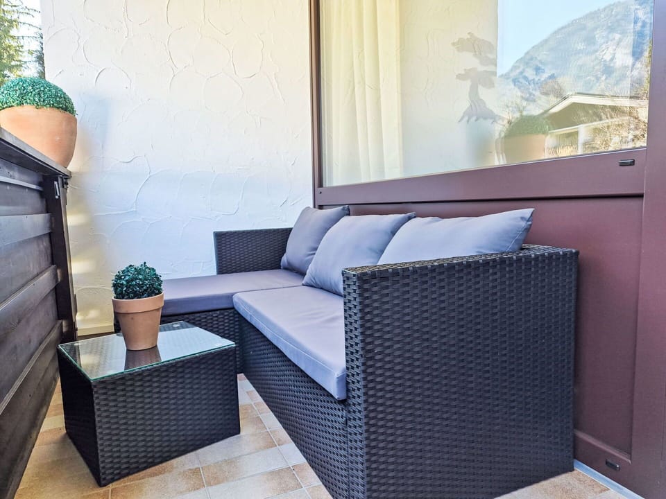 Furniture, Cushion, Outdoor Furniture, Floor, Couch, Throw Pillow, Hardwood, Wicker, Balcony