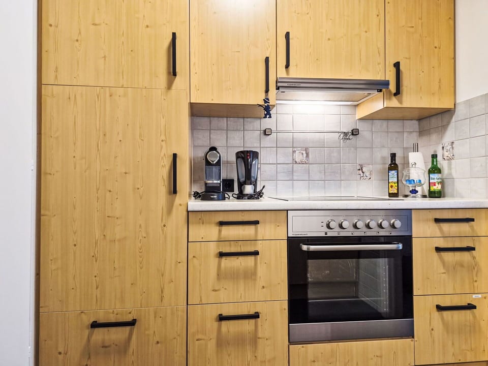 Cabinetry, Furniture, Wood, Flooring, Kitchen, Countertop, Drawer, Kitchen Appliance, Interior Design, Major Appliance