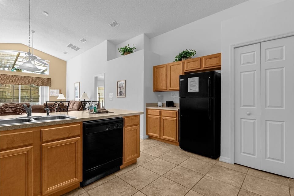 Kitchen Area With Fridge, Dual Sink & Dishwasher