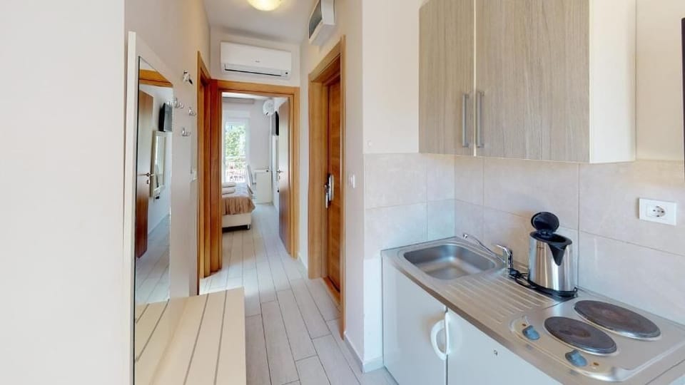 Family Apartment, Balcony | Private kitchen | Fridge, highchair