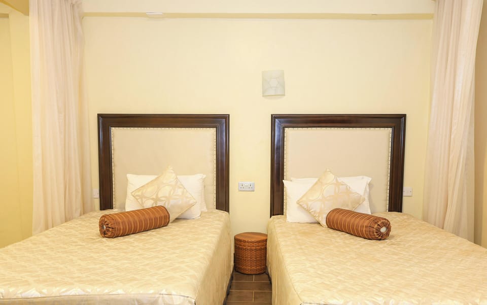 Standard Twin Room, Garden View | In-room safe, blackout drapes, soundproofing