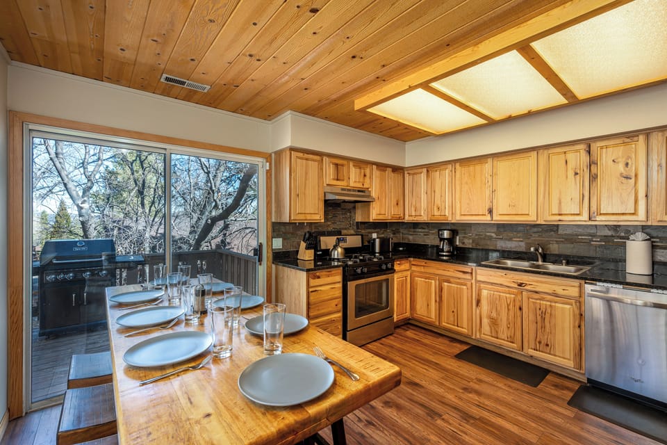 You'll love cooking in this warm wooden kitchen with its rustic charm and modern appliances, perfect for creating memorable meals together.