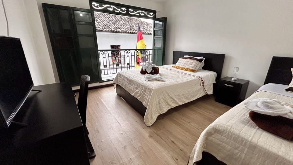 Standard Quadruple Room, Balcony, City View | Desk, laptop workspace, WiFi (free)