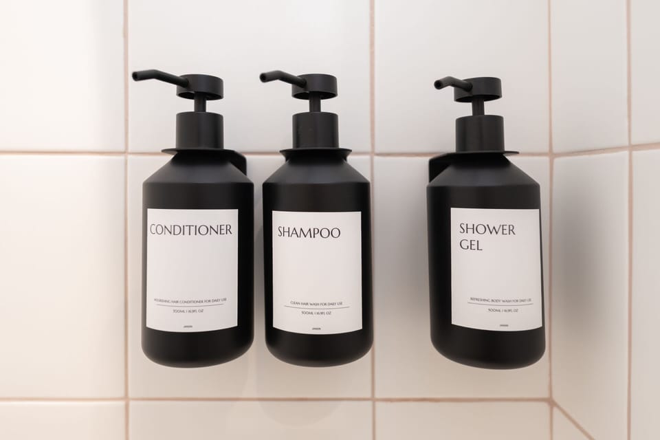 Shower, rainfall showerhead, hair dryer, towels