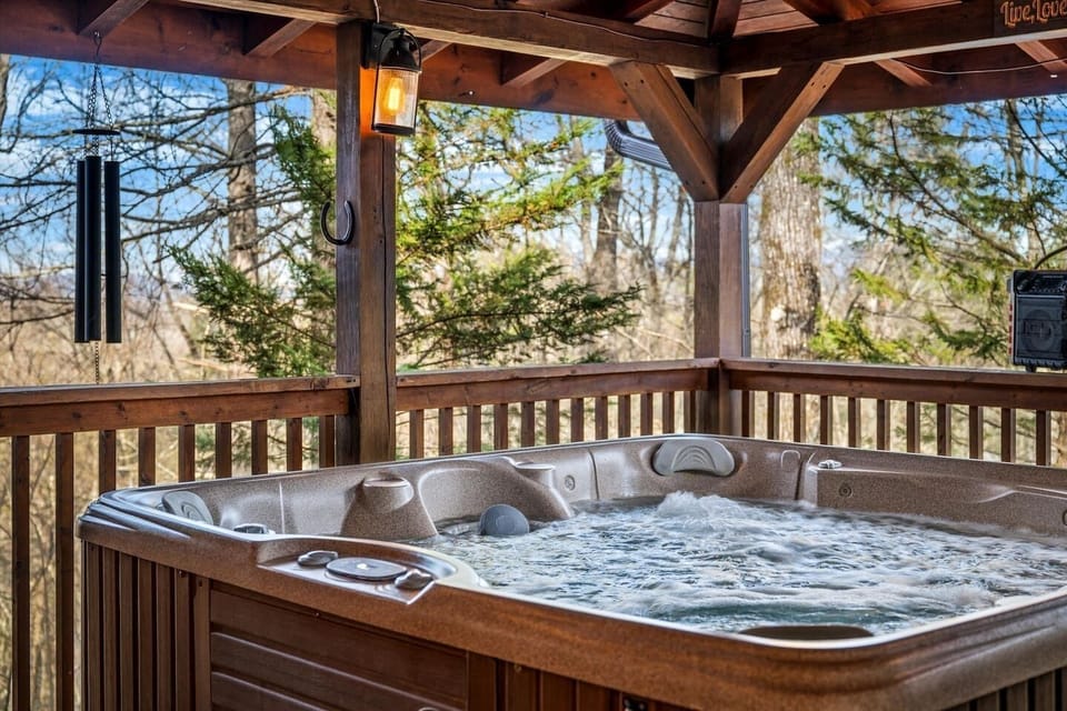 Sink in, breathe out — your private covered hot tub is steps from the cabin door, mountain forest all around you. Yours all night.