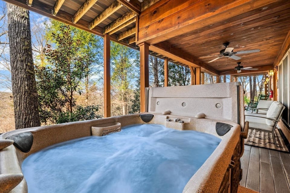 Soak under open sky with the mountain ridgeline in every direction — this is exactly what you booked the trip for.