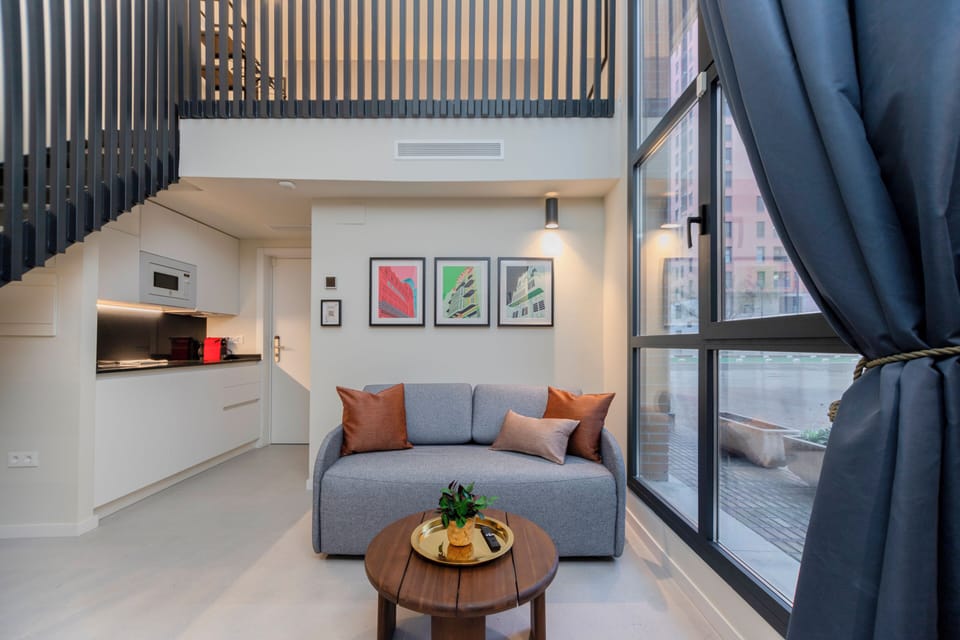 Deluxe Duplex | Living area | TV
