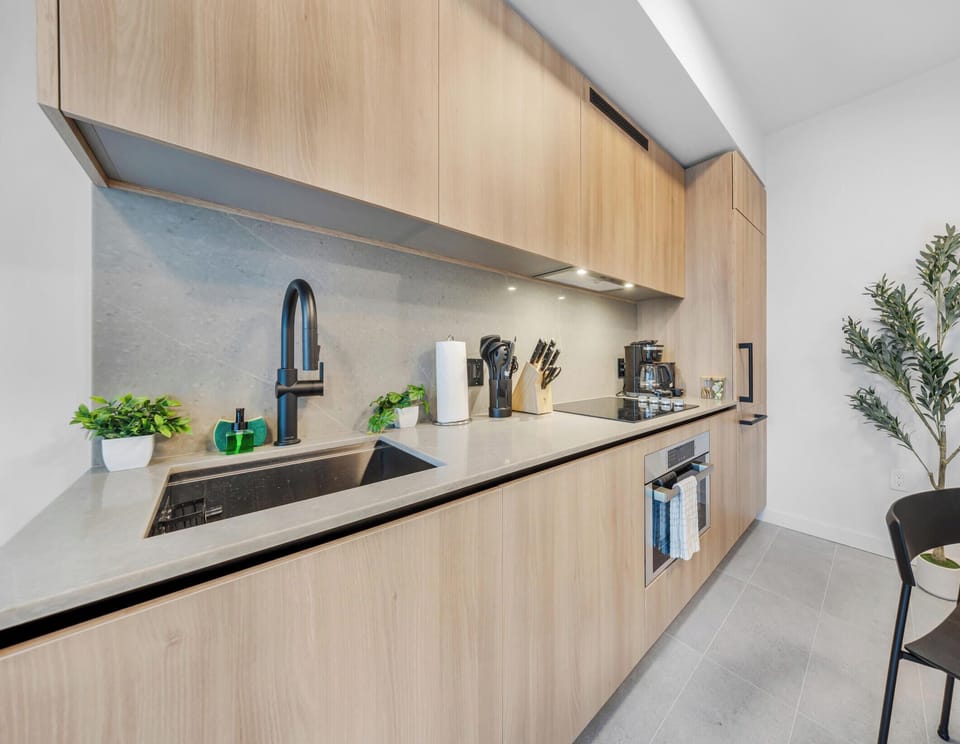 Condo, Balcony, City View | Private kitchen | Espresso maker, cookware/dishes/utensils, eco-friendly cleaning products