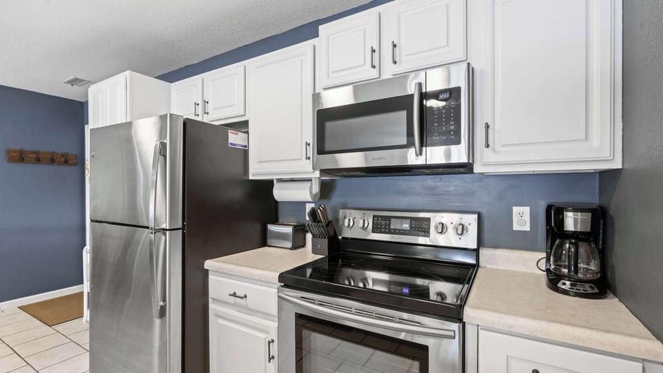 The open kitchen offers ample space & all the comforts of home​