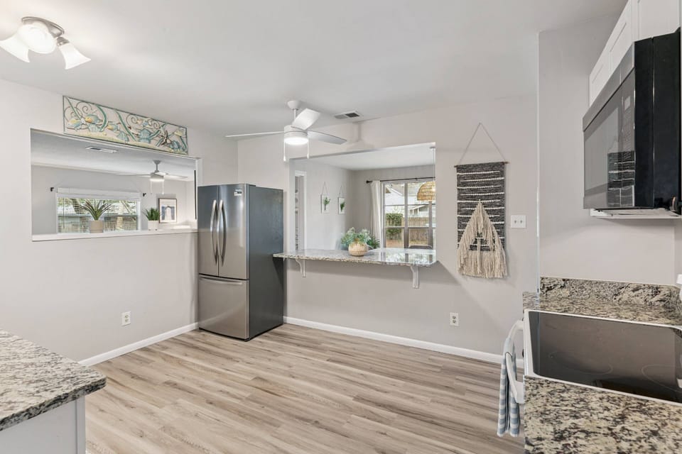 Keep an eye on everyone from the centrally located kitchen with windows overlooking the dining room, living room, and game room.