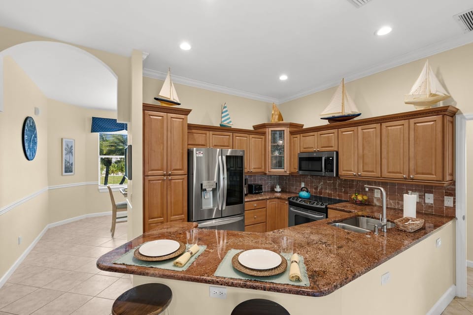 Kitchen: Cook up coastal cuisine in this bright, boat-themed kitchen with modern appliances!