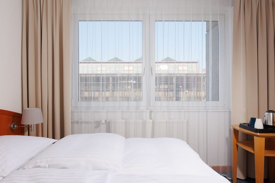 Hypo-allergenic bedding, in-room safe, desk, laptop workspace