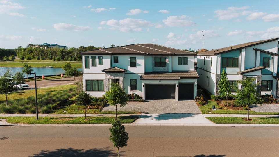 Experience a stunning blend of contemporary architecture and inviting landscaping. The sleek home features large windows for natural light, while the charming front path warmly welcomes you for a delightful stay.