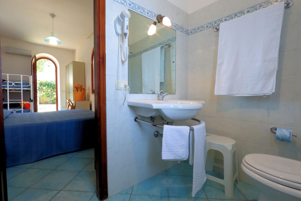 Standard Quadruple Room, Ground Floor | Desk, bed sheets