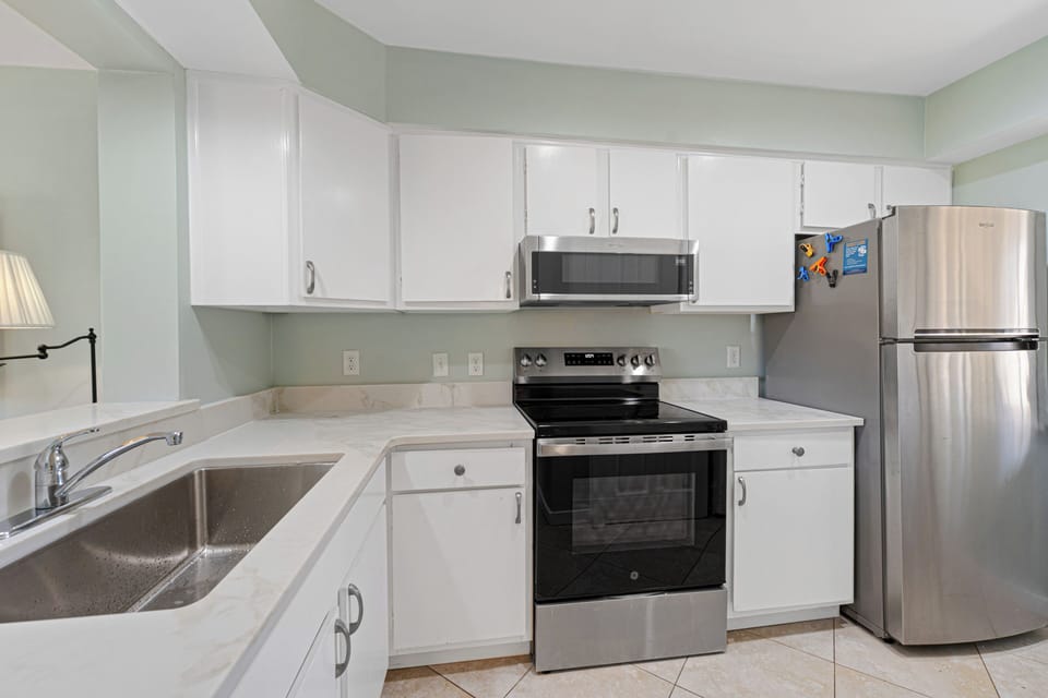 This bright kitchen offers everything needed for easy meal prep during your stay. With ample counter space, updated appliances, and a simple, open layout, it's designed for convenience.