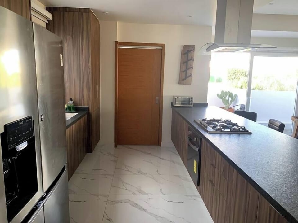 Cocina equipada y cuarto de lavado