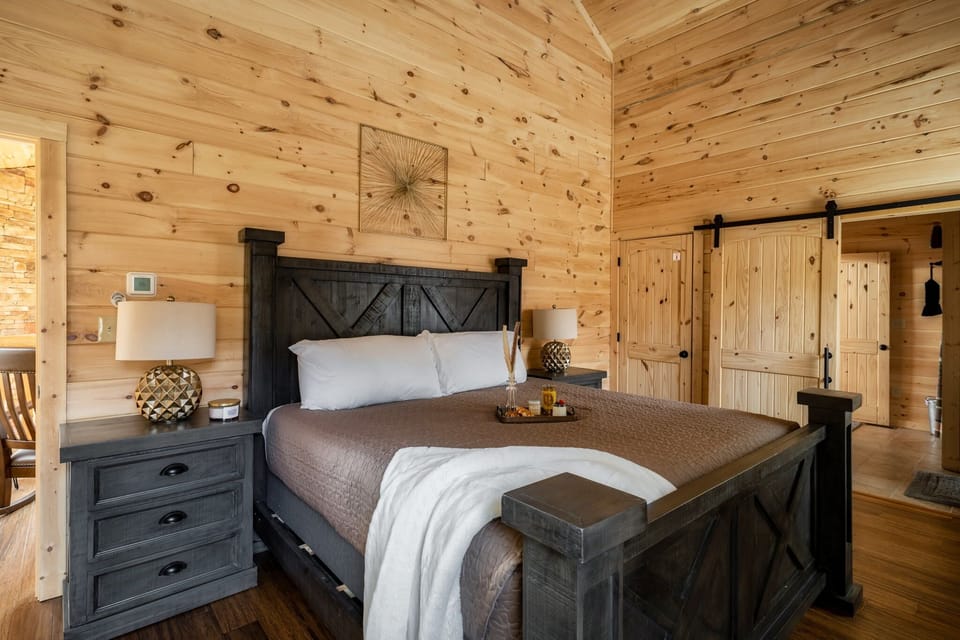 Stretch out in Bedroom 1's king bed under the vaulted pine ceiling.
