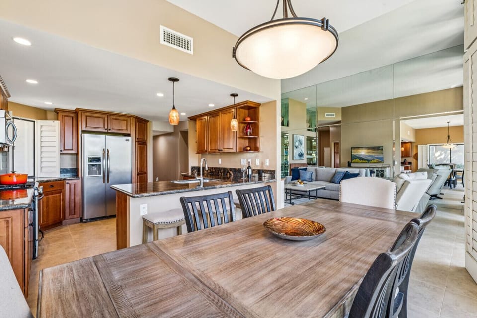 Open-concept layout connecting kitchen, dining & living spaces for easy gathering