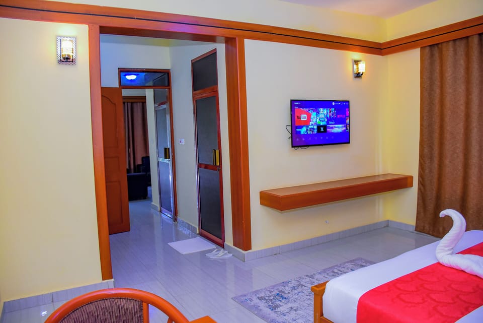 Executive Suite, Balcony, Garden View | Desk, laptop workspace, free WiFi