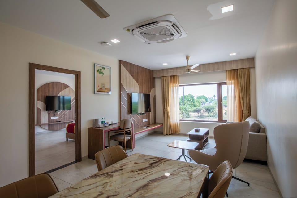 Premium Suite | Living area | 32-inch flat-screen TV with cable channels