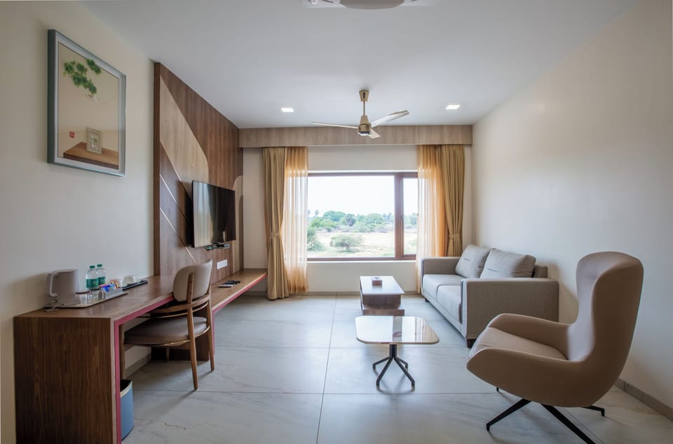 Premium Suite | Living area | 32-inch flat-screen TV with cable channels