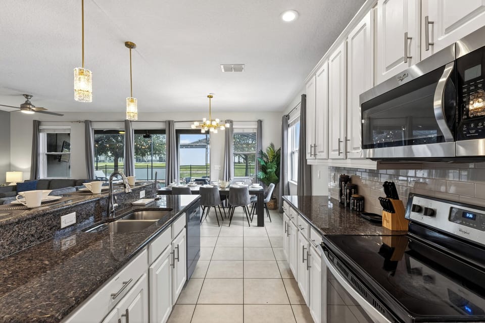 Cook with ease in the bright, fully stocked kitchen—ample counter space, modern appliances, and an open layout that flows right into dining and living.