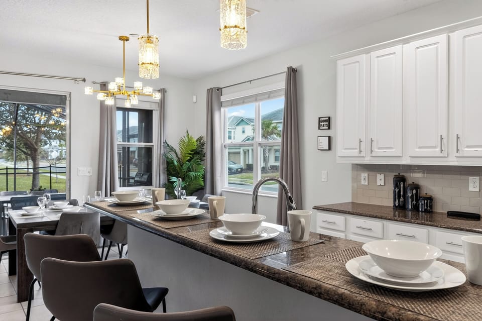 Prep, snack, and sip around the oversized kitchen island—an easy hub for the group with plenty of space to spread out.