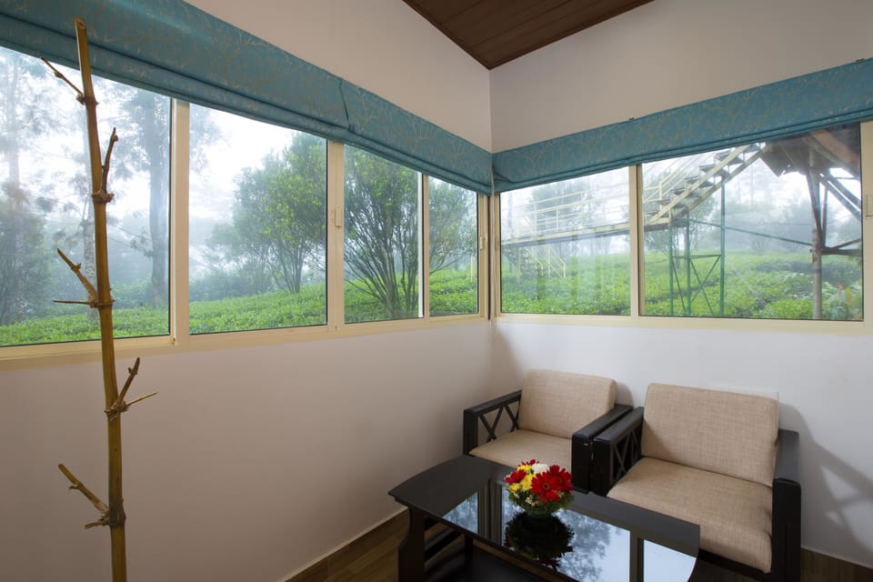 Tea Garden Honeymoon Cottage | Living room | 32-inch LED TV with cable channels, TV