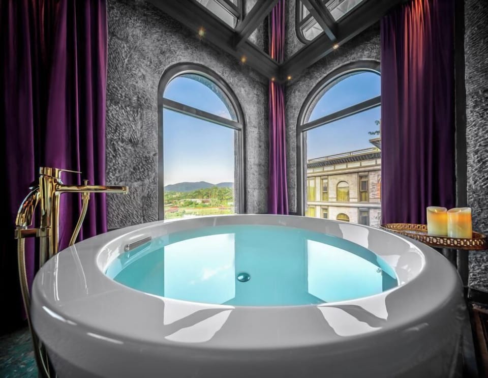Junior Suite, Lake View | Bathroom | Separate tub and shower, free toiletries, hair dryer, towels