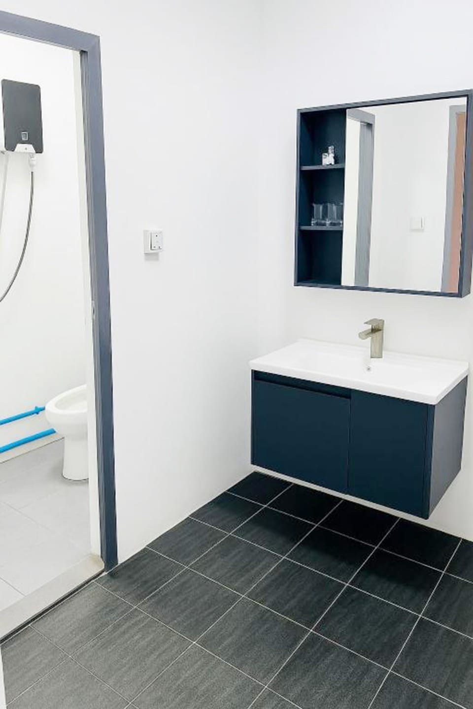 Shower, hair dryer, slippers, towels
