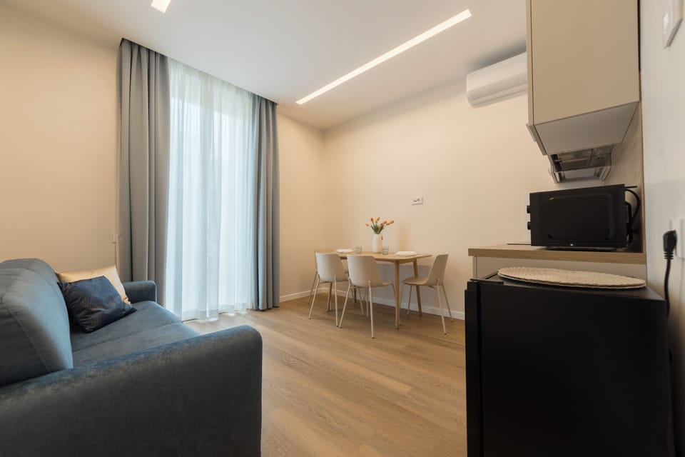 Exclusive Room, Balcony, City View | Living area | 39-inch flat-screen TV with digital channels, printers