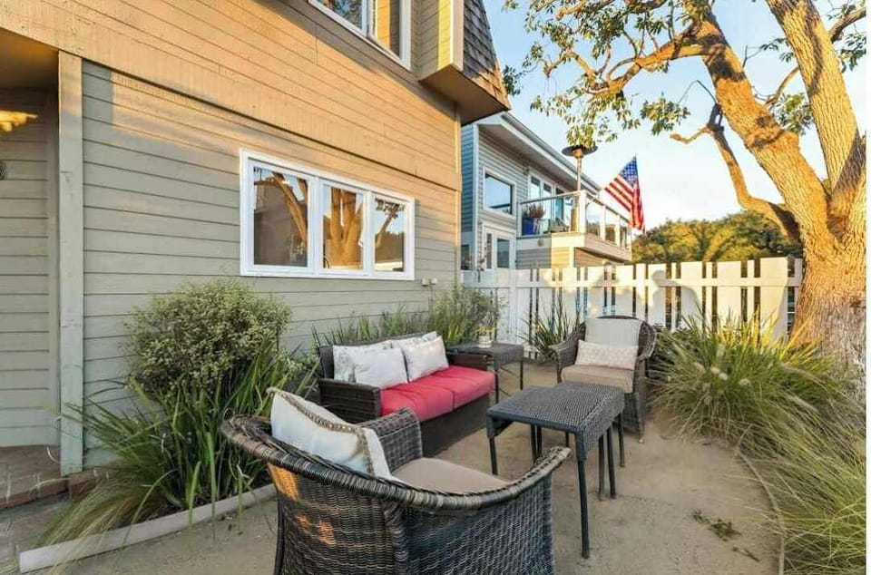 A private outdoor patio with comfortable seating, perfect for relaxing or enjoying fresh air.