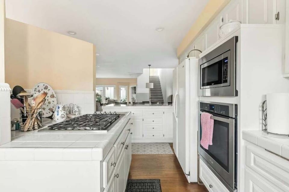 Functional kitchen layout with high end appliances. 