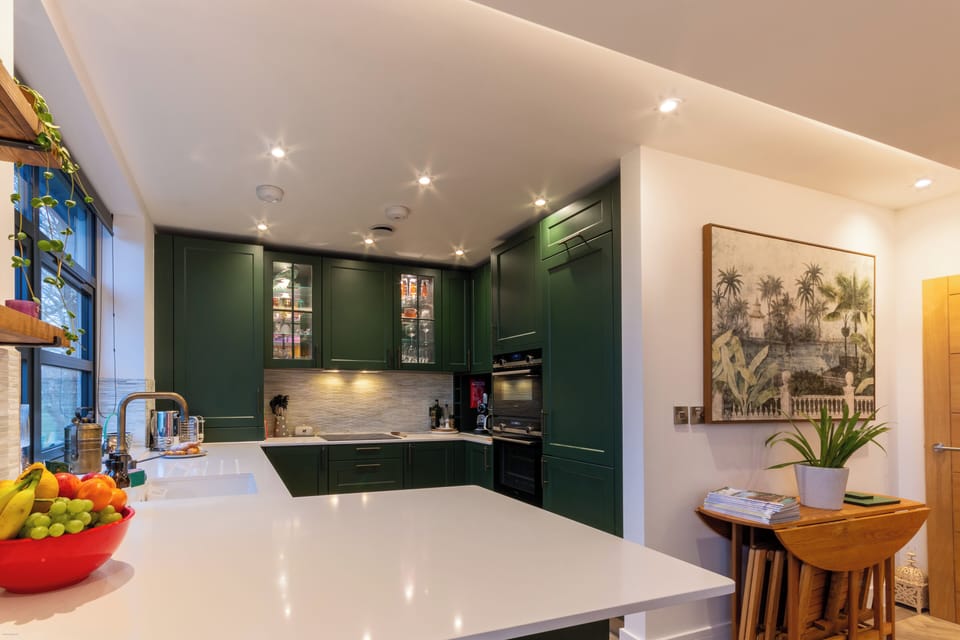 Fully equipped contemporary kitchen offering plenty of preparation space, integrated appliances, and a bright, sociable layout ideal for relaxed self-catering stays.