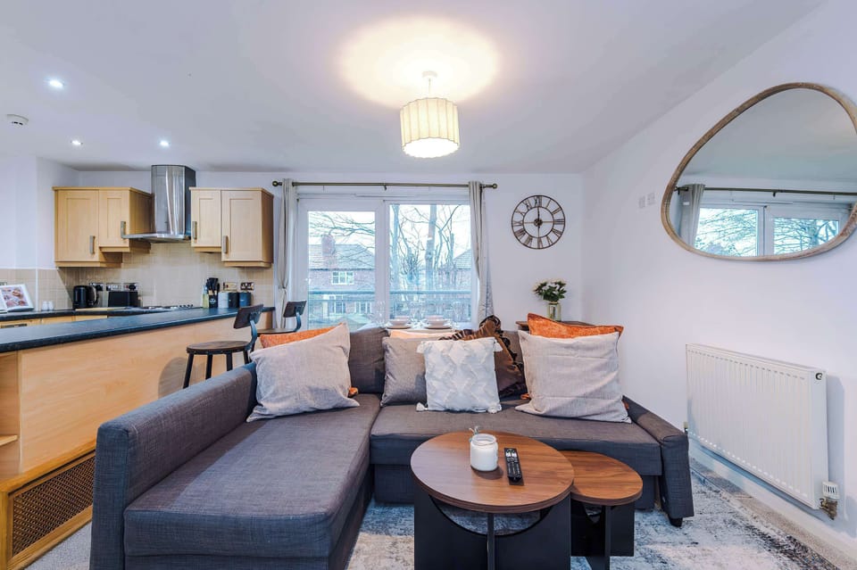 Living Room: Bright and inviting space with plush seating and a view to unwind after your adventures!