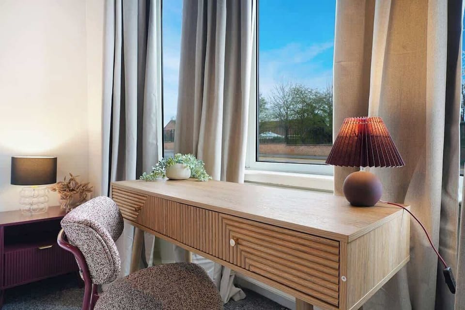 Spacious bedroom with a comfortable bed and modern finish, perfect for a restful night’s sleep.