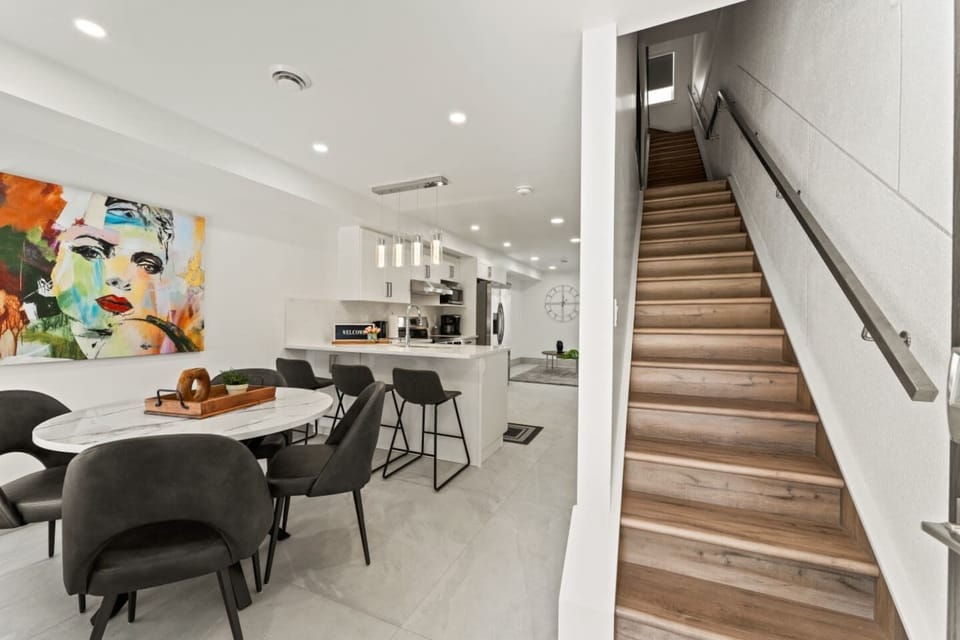 Stairs leading to the 2nd and 3rd floor bedroom areas.