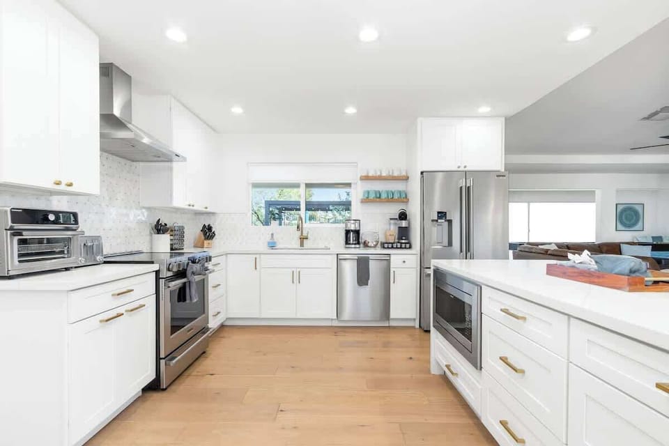 Your gourmet kitchen awaits with gleaming countertops, top-tier appliances, and everything you need to create memorable meals together.