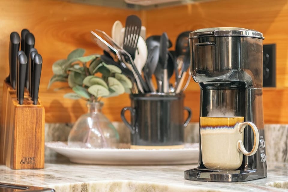 Start your mornings right with freshly brewed coffee from your sleek espresso machine, surrounded by everything you need for culinary adventures.
